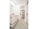 Bathroom features a marble countertop, white vanity, and access to an open closet with black shelving at 125 Point View Ct, Tyrone, GA 30290
