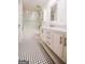 Clean bathroom with hexagon tile floor, large shower, and white vanity at 125 Point View Ct, Tyrone, GA 30290