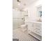 Charming bathroom with hexagon tile flooring, glass shower, and a white vanity at 125 Point View Ct, Tyrone, GA 30290
