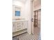 Bathroom features a marble countertop, white vanity, and access to an open closet with black shelving at 125 Point View Ct, Tyrone, GA 30290
