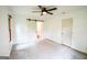 Spacious bedroom features three light filled windows and a sliding barn door leading to bathroom at 125 Point View Ct, Tyrone, GA 30290