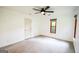 Bright bedroom with ceiling fan, new carpet and wooden window trim at 125 Point View Ct, Tyrone, GA 30290