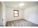 Bright bedroom with a window for natural light and neutral carpet at 125 Point View Ct, Tyrone, GA 30290