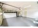 Large garage with gray painted floor at 125 Point View Ct, Tyrone, GA 30290