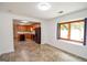 A well-lit kitchen with wood cabinets, stainless steel appliances and an adjacent open dining room at 125 Point View Ct, Tyrone, GA 30290
