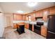 Well-equipped kitchen with ample cabinetry, stainless steel appliances, and an island for food preparation at 125 Point View Ct, Tyrone, GA 30290