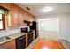 Spacious kitchen with stainless appliances, tile backsplash, wood cabinets, and an adjoining dining area at 125 Point View Ct, Tyrone, GA 30290