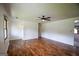 Inviting living room showcasing hardwood floors, neutral walls, and a ceiling fan for added comfort at 125 Point View Ct, Tyrone, GA 30290
