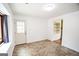 An empty room with a door leading to the outside and another doorway leading to another room at 125 Point View Ct, Tyrone, GA 30290