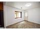An empty room with a window letting in natural light and a door leading to the outside at 125 Point View Ct, Tyrone, GA 30290
