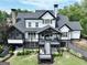 Aerial view of a home with a multi-level deck overlooking a landscaped backyard at 383 Beaumont Farms Dr, Sharpsburg, GA 30277