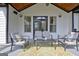 Charming back porch with comfortable seating offers a relaxing outdoor space at 383 Beaumont Farms Dr, Sharpsburg, GA 30277