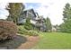 Beautiful backyard of house featuring well-manicured lawn, multiple decks, and mature trees at 383 Beaumont Farms Dr, Sharpsburg, GA 30277