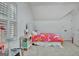 Attic bedroom featuring a playful design with a large bed and white walls at 383 Beaumont Farms Dr, Sharpsburg, GA 30277