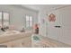 Bright bedroom features a sitting area, plush pillows and an accent rug at 383 Beaumont Farms Dr, Sharpsburg, GA 30277