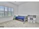 Serene bedroom with a twin bed, window with shutters, and built in bookcase at 383 Beaumont Farms Dr, Sharpsburg, GA 30277