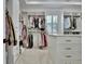 A spacious walk-in closet with custom shelving, drawers, and ample hanging space at 383 Beaumont Farms Dr, Sharpsburg, GA 30277
