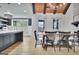 This dining room has high ceilings with wooden beams, modern lighting, and a stylish beverage station at 383 Beaumont Farms Dr, Sharpsburg, GA 30277
