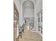Spacious foyer with high ceilings, hardwood floors, elegant lighting, and a staircase at 383 Beaumont Farms Dr, Sharpsburg, GA 30277