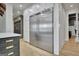 Kitchen features an oversized stainless refrigerator, custom cabinets, and a large island for gourmet food preparation at 383 Beaumont Farms Dr, Sharpsburg, GA 30277