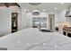 This kitchen boasts stainless steel appliances, white marble countertops, and a large island for preparing gourmet meals at 383 Beaumont Farms Dr, Sharpsburg, GA 30277