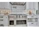 Close-up showcasing a modern kitchen with high-end stainless steel appliances and decorative backsplash at 383 Beaumont Farms Dr, Sharpsburg, GA 30277
