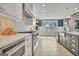 Bright kitchen featuring custom cabinets, stainless steel appliances, and modern finishes throughout at 383 Beaumont Farms Dr, Sharpsburg, GA 30277