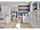 Gourmet kitchen features modern appliances, custom cabinets, and a cozy beverage station, perfect for entertaining guests at 383 Beaumont Farms Dr, Sharpsburg, GA 30277