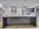 Spacious kitchen with a large center island, pendant lighting, and modern appliances for cooking and entertaining at 383 Beaumont Farms Dr, Sharpsburg, GA 30277