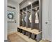 This mudroom features custom storage cubbies and seating at 383 Beaumont Farms Dr, Sharpsburg, GA 30277
