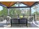 Cozy outdoor porch with comfortable seating and a peaceful view of the surrounding greenery at 383 Beaumont Farms Dr, Sharpsburg, GA 30277