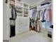 Large walk-in closet boasts custom built-in shelving for ample storage at 383 Beaumont Farms Dr, Sharpsburg, GA 30277