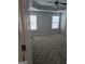 Bright primary bedroom featuring two windows and neutral carpet at 1601 Celestial Ct, Mcdonough, GA 30253