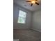 Bedroom featuring carpeted floors, a ceiling fan, and natural light at 1601 Celestial Ct, Mcdonough, GA 30253