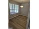 Dining area features bright windows with natural light and hardwood floors at 1601 Celestial Ct, Mcdonough, GA 30253