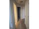 Hallway with wood flooring and white doors to other rooms at 1601 Celestial Ct, Mcdonough, GA 30253