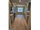 Spacious kitchen with stainless steel appliances and wooden floors at 1601 Celestial Ct, Mcdonough, GA 30253