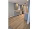 Kitchen with gray cabinets, stainless steel appliances and wood floor at 1601 Celestial Ct, Mcdonough, GA 30253