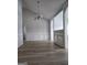 Open-concept living room featuring wainscoting, decorative columns, and wood plank flooring at 1601 Celestial Ct, Mcdonough, GA 30253