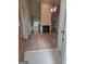 Open-concept living room featuring plank flooring, fireplace, and neutral paint at 1601 Celestial Ct, Mcdonough, GA 30253