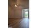 Spacious living room showcasing modern ceiling fan and open entry to front door at 1601 Celestial Ct, Mcdonough, GA 30253