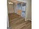 Open living room with light wood floors and decorative molding at 1601 Celestial Ct, Mcdonough, GA 30253