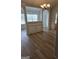 Living room showcasing hardwood floors and decorative archways at 1601 Celestial Ct, Mcdonough, GA 30253
