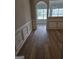 Living room featuring hardwood floors, wainscoting, and neutral paint at 1601 Celestial Ct, Mcdonough, GA 30253