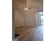 Open-concept living room with neutral paint and ceiling fan at 1601 Celestial Ct, Mcdonough, GA 30253