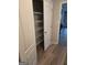Pantry featuring adjustable metal shelving, white trim, and luxury vinyl flooring at 1601 Celestial Ct, Mcdonough, GA 30253