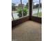 Enclosed brick patio with view of lawn, trees, and vinyl fencing at 1601 Celestial Ct, Mcdonough, GA 30253