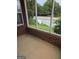 Enclosed patio with brick accents offers a serene view of the landscaped surroundings at 1601 Celestial Ct, Mcdonough, GA 30253