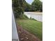 Enclosed patio view of lawn, trees, and vinyl privacy fence at 1601 Celestial Ct, Mcdonough, GA 30253