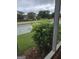 View from enclosed patio showing lawn, trees, and a vinyl privacy fence at 1601 Celestial Ct, Mcdonough, GA 30253